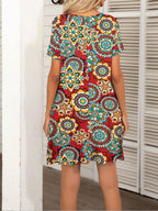 Pocketed Printed Round Neck Short Sleeve Mini Dress - All In The Bag